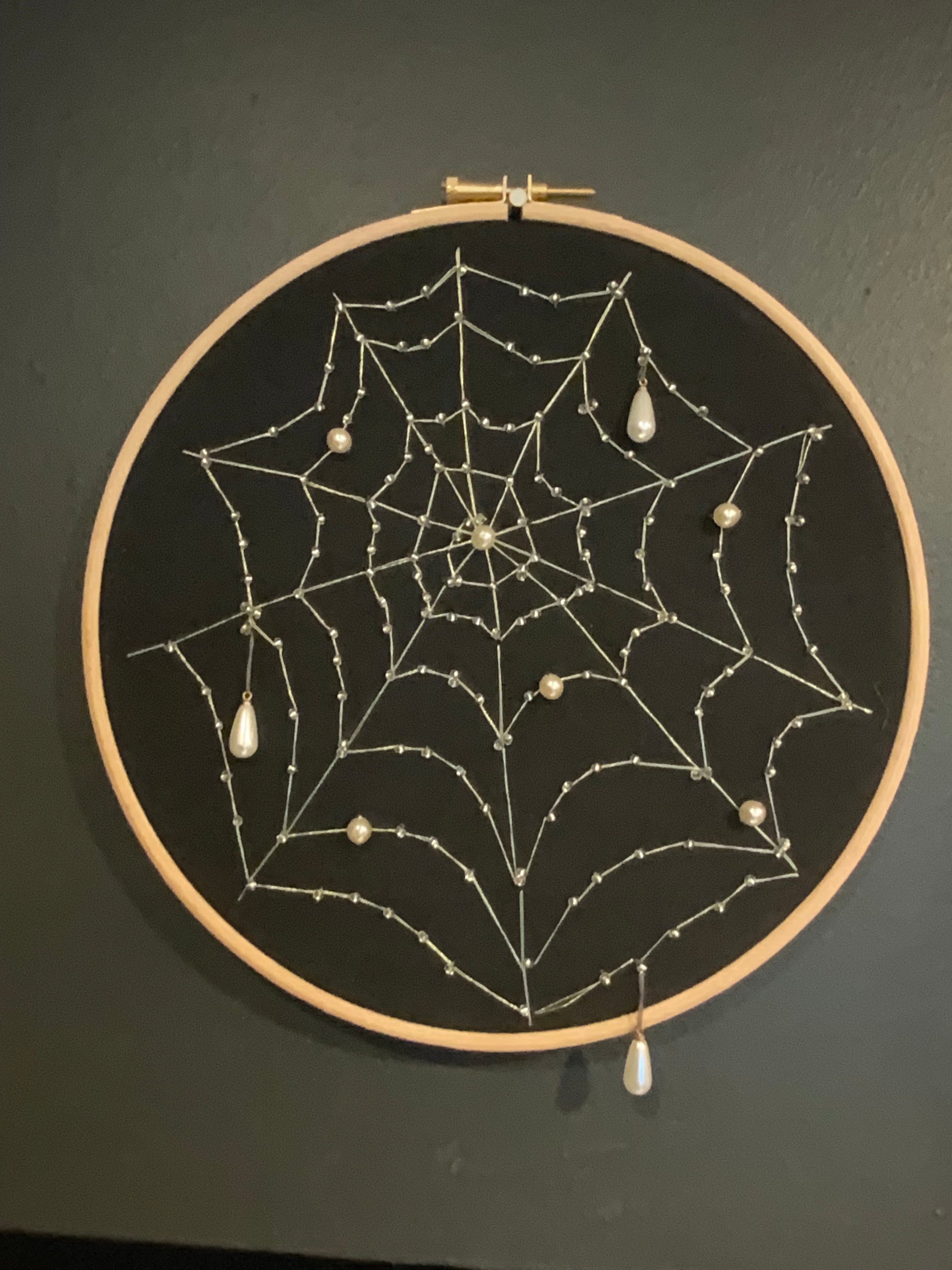 Embroidered cobweb